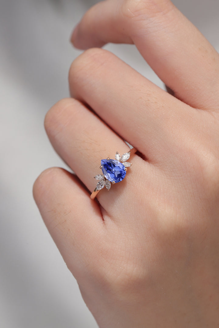 Nature Inspired Pear Cut Cornflower Sapphire with Petal Side Gemstone Ring - Iver Jewelry