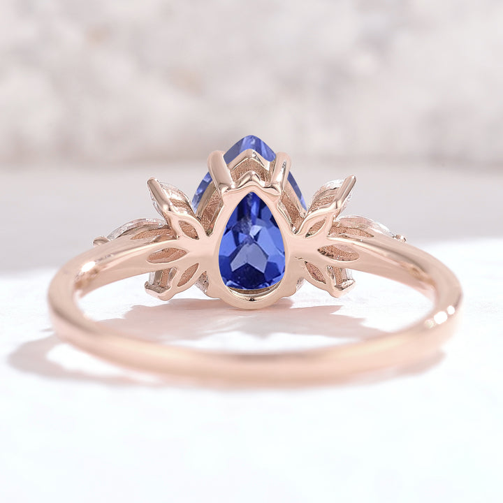 Nature Inspired Pear Cut Cornflower Sapphire with Petal Side Gemstone Ring - Iver Jewelry