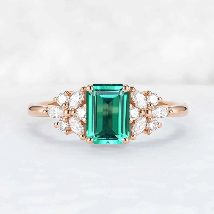 Nature Inspired Emerald Cut Emerald Ring with Petal Moissanite Side Stones
