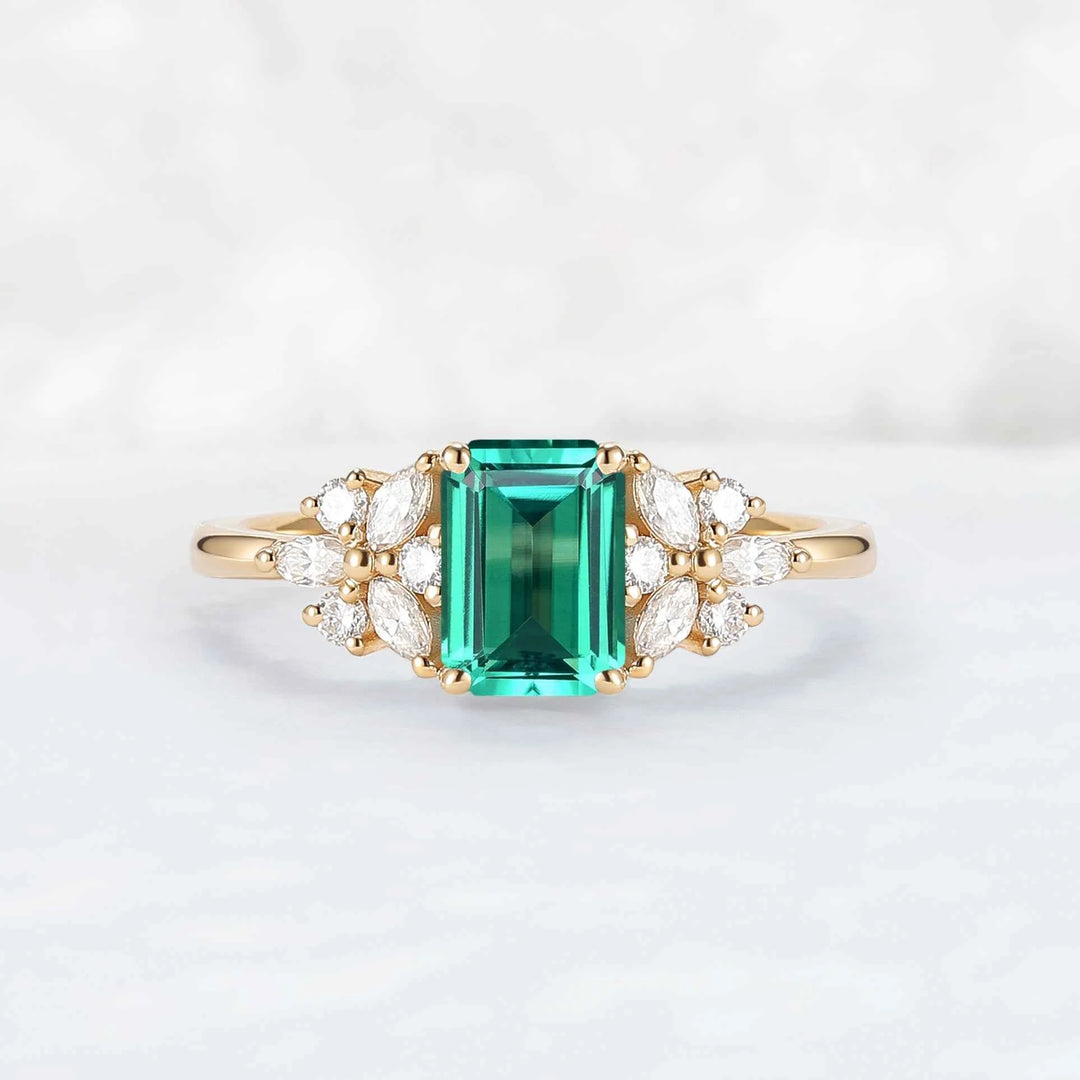 Nature Inspired Emerald Cut Emerald Ring with Petal Moissanite Side Stones
