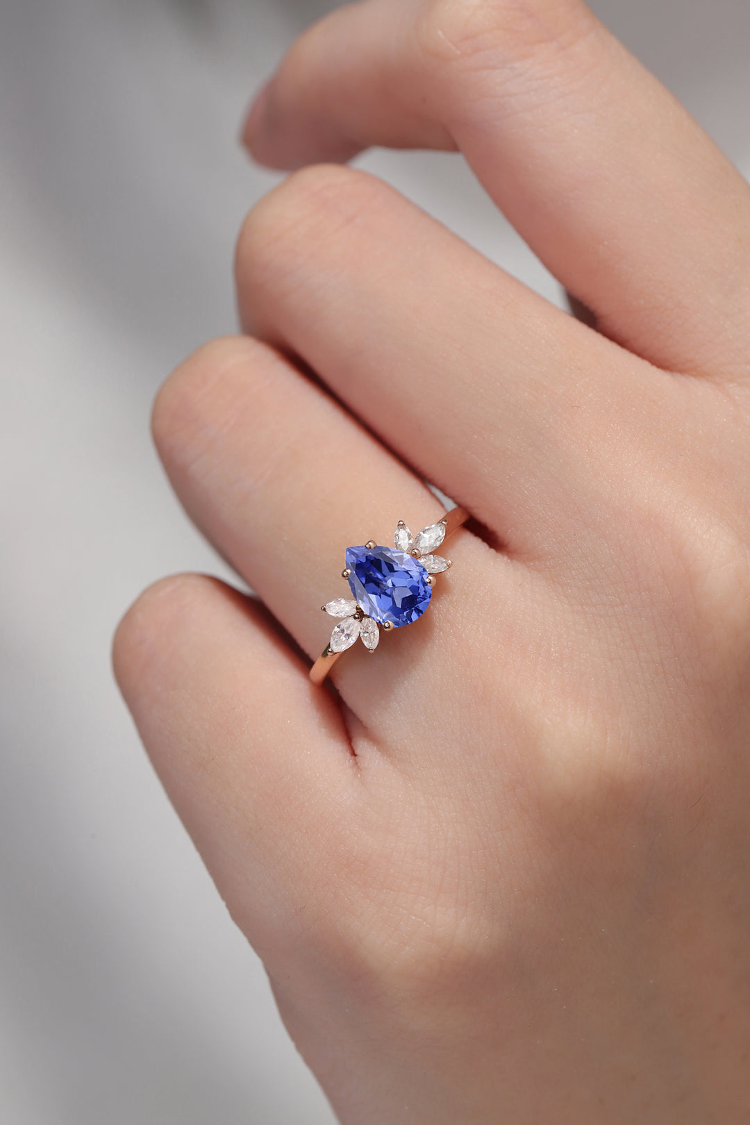 Nature Inspired Pear Cut Cornflower Sapphire with Petal Side Gemstone Ring