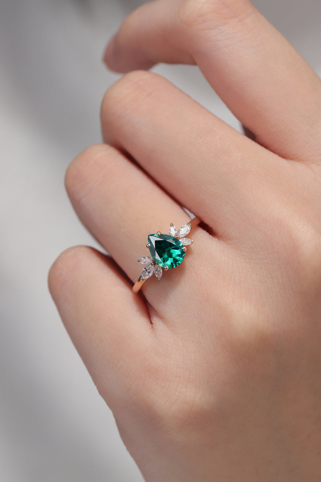 Nature Inspired Pear Cut Emerald with Petal Side Gemstone Ring