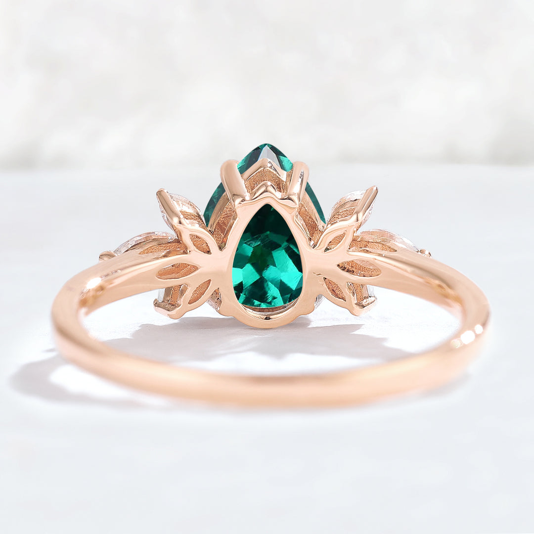 Nature Inspired Pear Cut Emerald with Petal Side Gemstone Ring