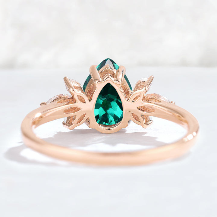 Nature Inspired Pear Cut Emerald with Petal Side Gemstone Ring