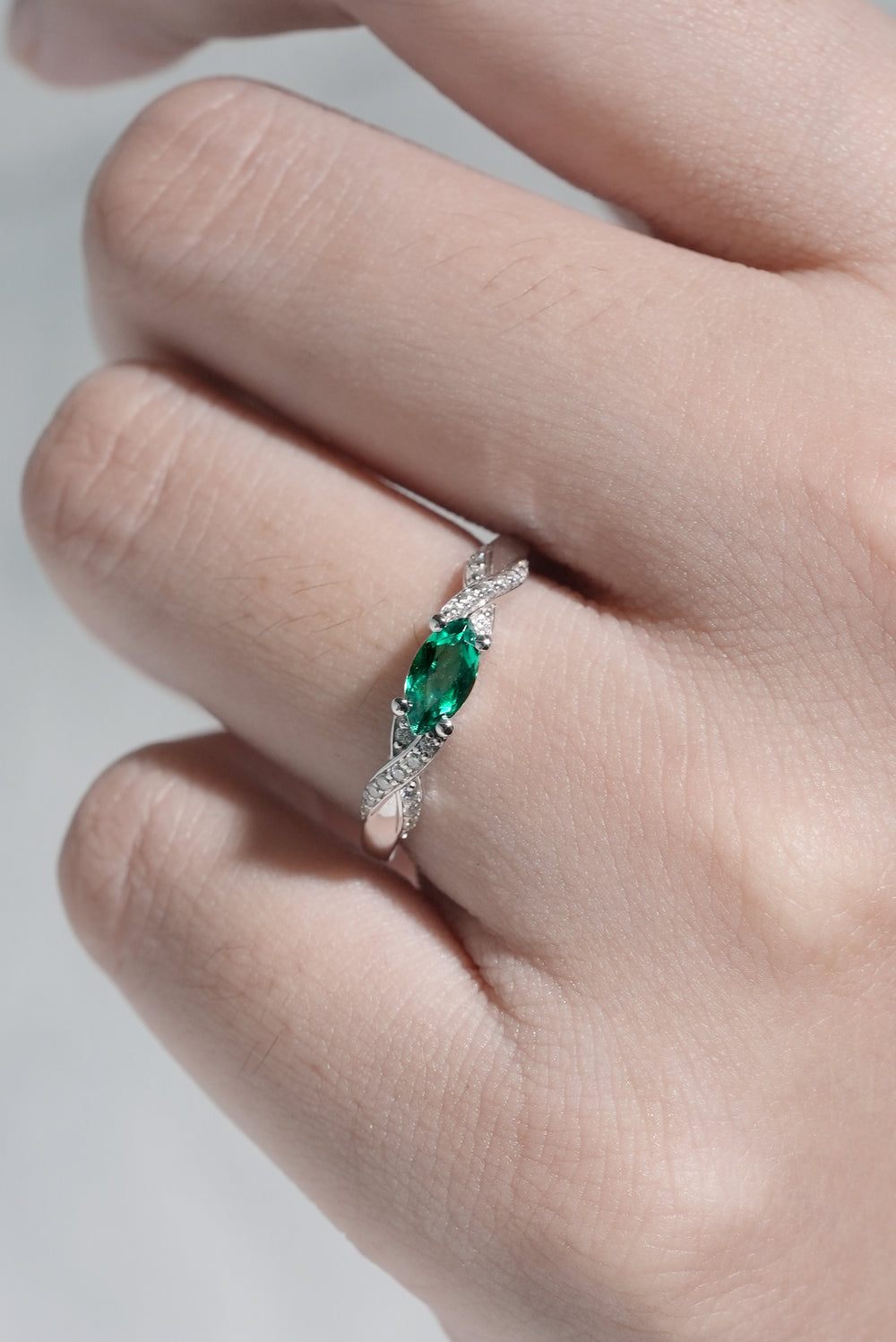 Straight_Marquise_Cut_Emerald_and_Moissanite_Mobius_Wedding_Band_6