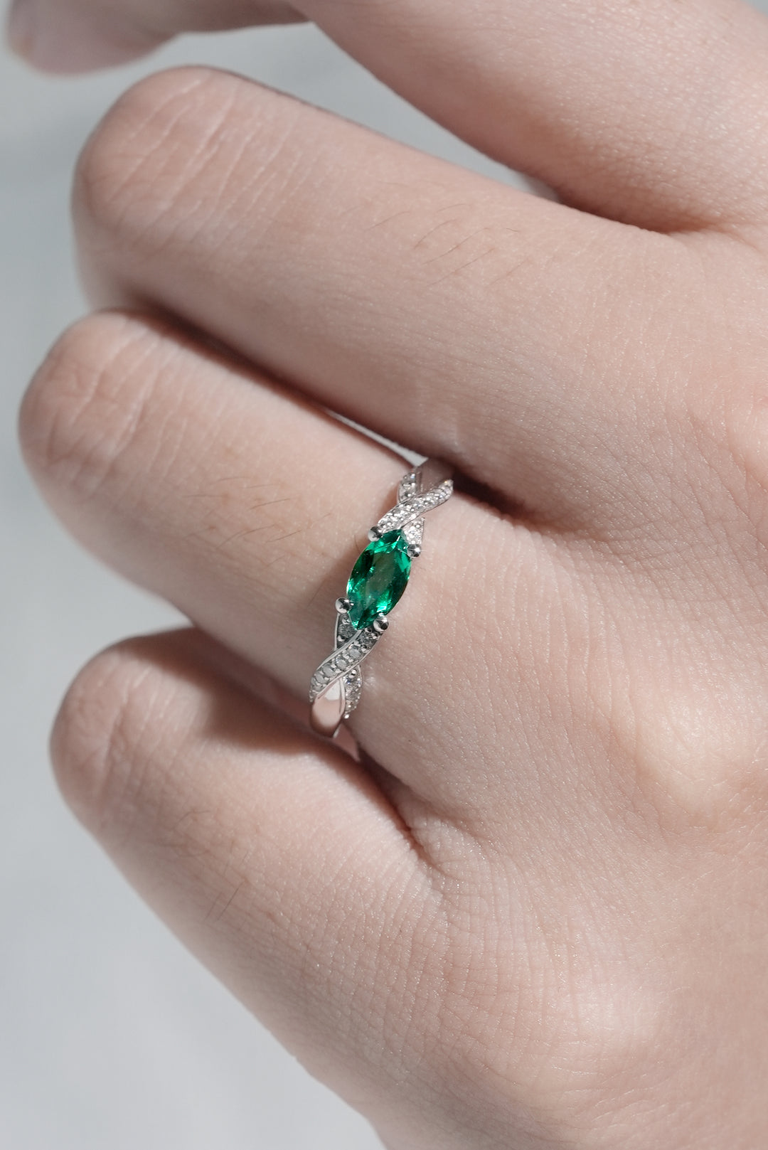 Straight_Marquise_Cut_Emerald_and_Moissanite_Mobius_Wedding_Band_6