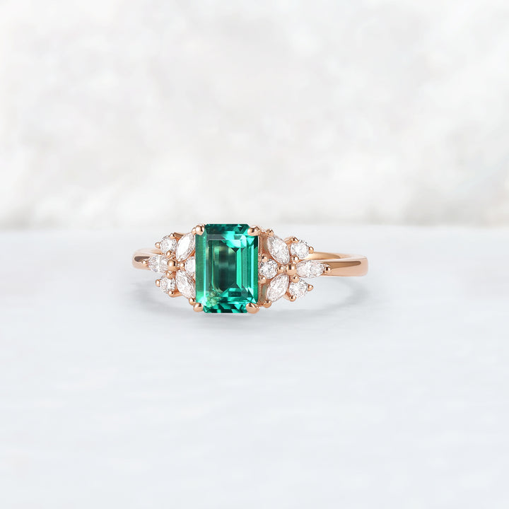 Nature Inspired Emerald Cut Emerald Ring with Petal Moissanite Side Stones
