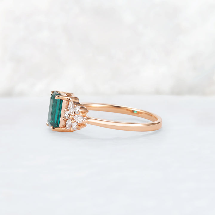 Nature Inspired Emerald Cut Emerald Ring with Petal Moissanite Side Stones