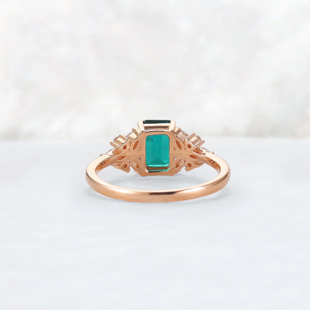 Nature Inspired Emerald Cut Emerald Ring with Petal Moissanite Side Stones